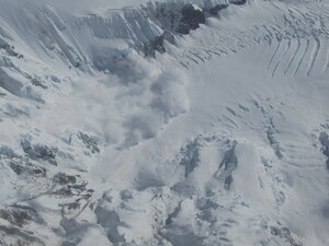 Truly amazingly, as we flew overhead I noticed an avalanche in the mountains beneath us and was able to capture the end of it.