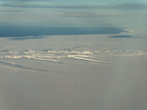 Reaching the Brunt Ice Shelf in the plane and seeing the rumples for the first time this time round. These are the natural stress fractures caused by the grounding of the shelf on a submarine seamount.