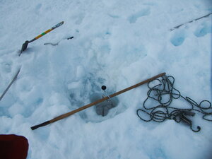 The "slushiness" of the hole meant that it freezes back up very, very quickly. As a result we made sure there was something keeping the hole alive!