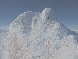 The craziness of snow and ice formations at the top of mountains.